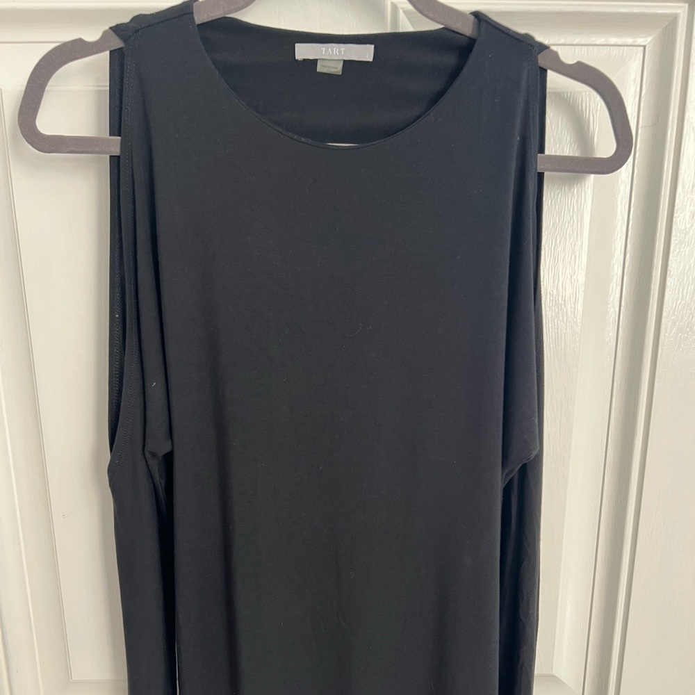 Open shoulder long sleeve black top.